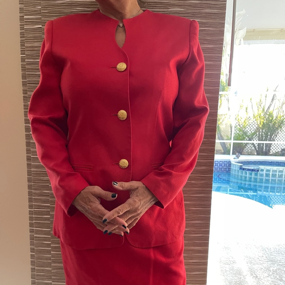 Red power suit with gold buttons.  Waist is 27”.